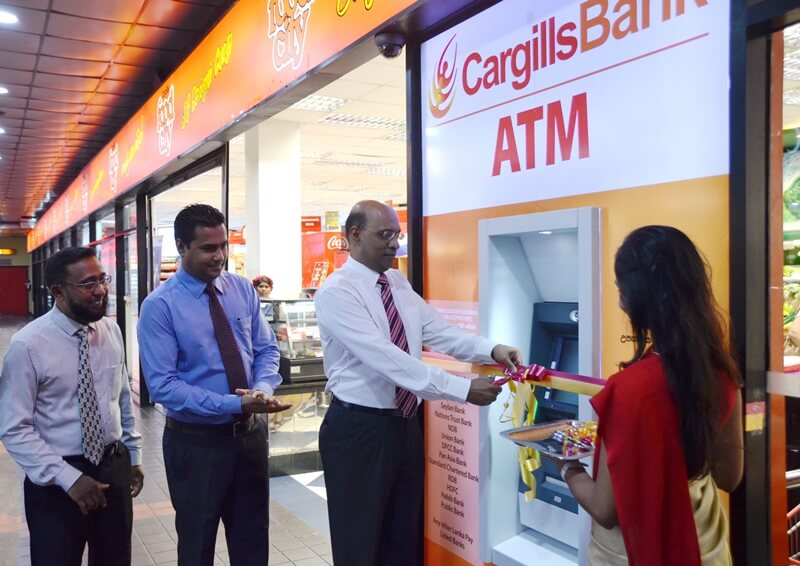 Cargills Bank Managing Director / CEO Mr. Prabhu Mathavan declaring the Majestic City Off-site ATM open, along with DGM Consumer Banking - Mr. Lewie Diasz and Mr. Rumaiz Rahim - DGM Marketing.